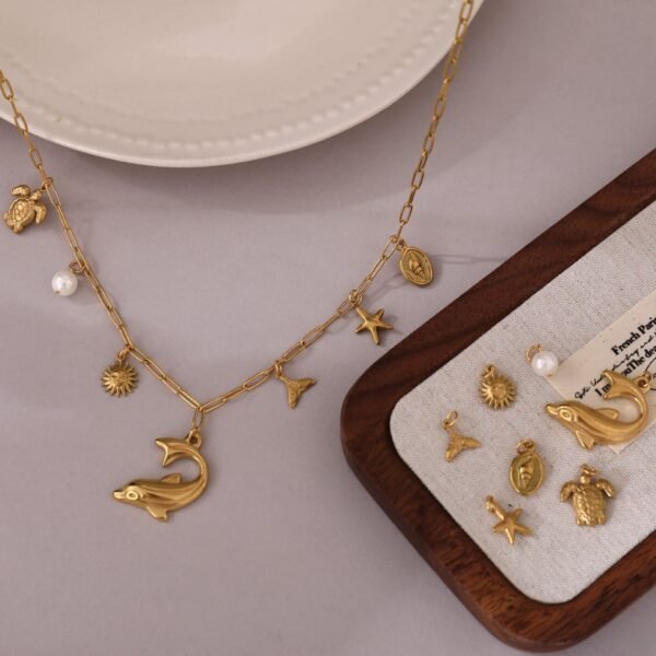 18k Gold Plated Stainless Steel Beach Theme Summer Vibe Charm Necklace with Star Fish Sea Shell Turtle Charms - Image 5