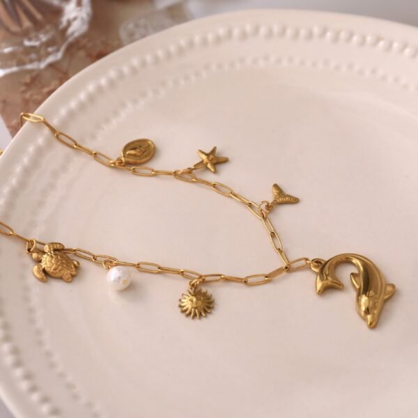 18k Gold Plated Stainless Steel Beach Theme Summer Vibe Charm Necklace with Star Fish Sea Shell Turtle Charms - Image 2